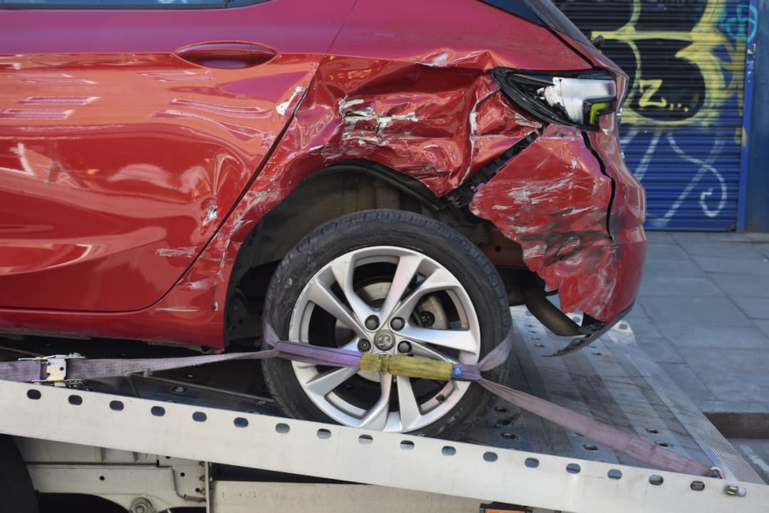 Damaged vehicle on a tow truck